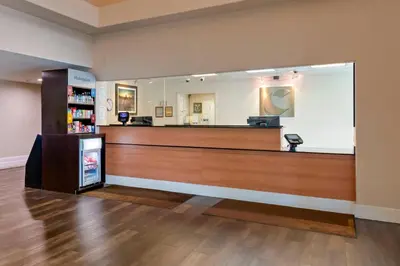 a cashier counter in a store with a mirror at Comfort Suites Victorville-Hesperia in Victorville
