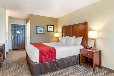 a hotel room with a bed and a telephone at Comfort Inn & Suites Lancaster Antelope Valley in Lancaster