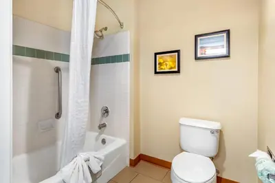 a bathroom with a white toilet and a shower at Comfort Inn & Suites Lancaster Antelope Valley in Lancaster