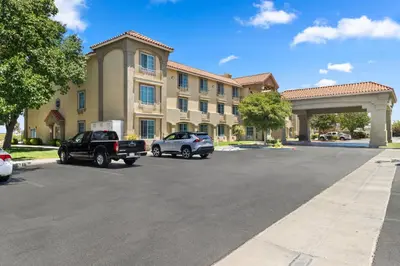 a parking lot in front of a large building at Comfort Inn & Suites Lancaster Antelope Valley in Lancaster