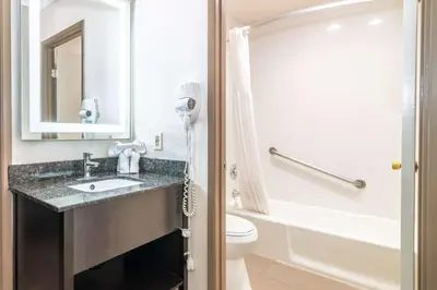 a bathroom with a sink and a toilet at Rodeway Inn Barstow Route 66 in Barstow
