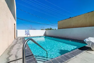 a swimming pool on the side of a building at Rodeway Inn Barstow Route 66 in Barstow