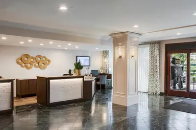 a lobby with a reception desk in a building at Ayres Suites Yorba Linda/Anaheim Hills in Anaheim