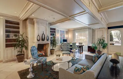 a living room filled with furniture and a fireplace at Ayres Hotel Seal Beach - Cypress in Seal Beach