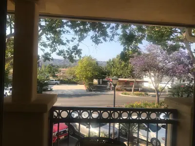 a window with a view of a parking lot at Bella Capri Inn and Suites in Camarillo