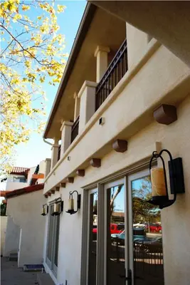 a building with a balcony on the side of it at Bella Capri Inn and Suites in Camarillo