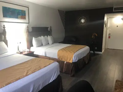 a hotel room with two beds and a window at Knights Inn Los Angeles Central / Convention Center Area in Los Angeles