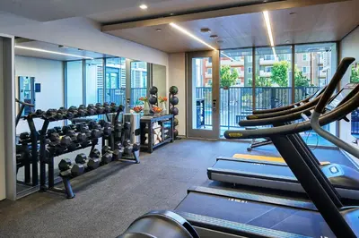 a gym with cardio equipment in a building at Hotel Mariposa in Los Angeles