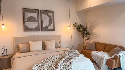 a bedroom with a bed and a couch at Lovely Studio in heart of Hollywood in Los Angeles