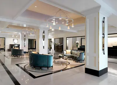 a lobby with a couch and chairs and a table at The London West Hollywood at Beverly Hills in Los Angeles