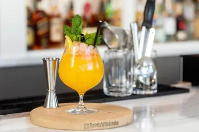 a drink on a wooden board on a counter at AC Hotel by Marriott Los Angeles South Bay in Los Angeles