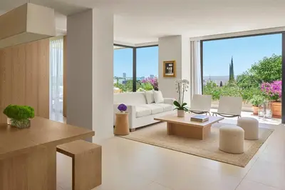 a living room with a white couch and a table at The West Hollywood EDITION in Los Angeles