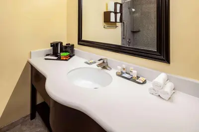 a bathroom with a white sink and a mirror at La Quinta by Wyndham Inglewood in Inglewood
