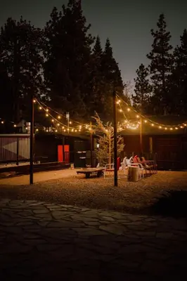 a park with a group of tables and lights at Noon Lodge in Big Bear Lake