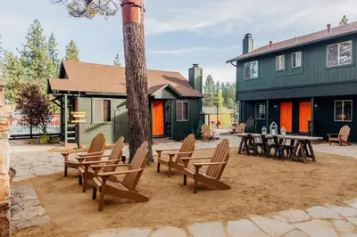 a group of chairs and a table in front of a house at Noon Lodge in Big Bear Lake