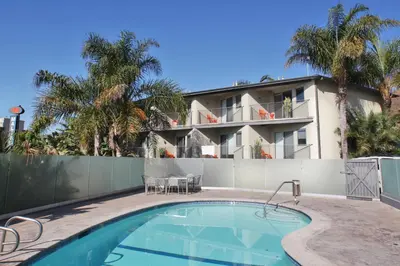 a house with a swimming pool and a building at The M Malibu in Malibu