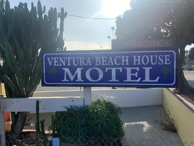 a blue sign for a venice beach house motel at Ventura Beach House Motel in Ventura