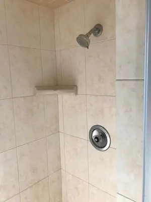 a shower with a shower head in a bathroom at Ventura Beach House Motel in Ventura