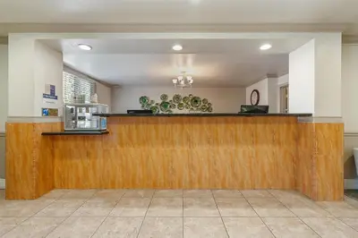 a lobby with a wooden bar in a store at Best Western Plus John Jay Inn & Suites in Palmdale