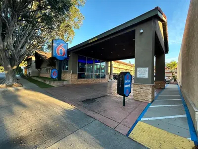 a gas station with a pay phone in front of it at Motel 6 Pasadena, CA Old Town Pasadena Area in Pasadena