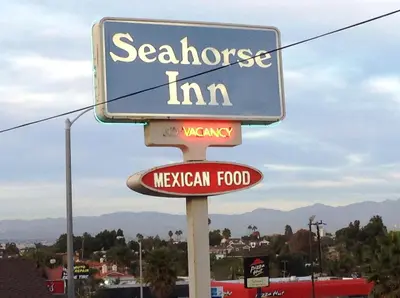 a sign for a mexican food restaurant at Seahorse Inn Manhattan Beach - LAX in Manhattan Beach