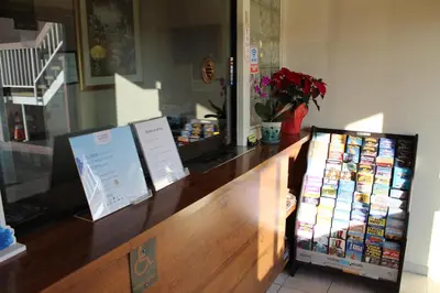 a store with a counter with books on it at Travelodge by Wyndham Buena Park in Buena Park