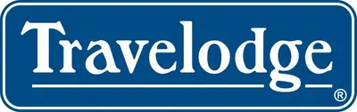 a blue sign with the words at Travelodge by Wyndham Buena Park in Buena Park