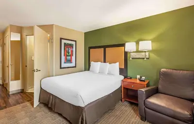 a hotel room with a bed and a chair at Extended Stay America Suites - Bakersfield - Chester Lane in Bakersfield