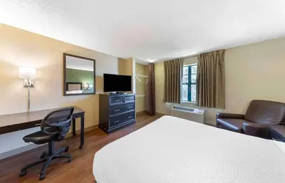 a hotel room with a bed and a desk and chair at Extended Stay America Suites - Los Angeles - Glendale in Glendale