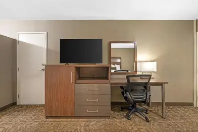 an office with a desk with a television and a chair at Best Western Plus Anaheim Inn in Anaheim