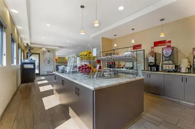 a large kitchen with a counter in a store at Best Western Plus Anaheim Inn in Anaheim