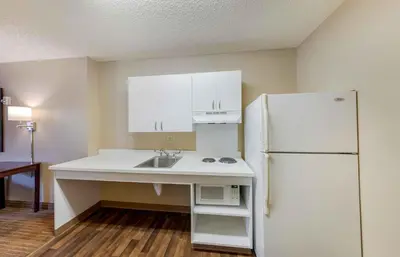 a kitchen with a sink and a white refrigerator at Extended Stay America Suites - Los Angeles - Simi Valley in Santa Susana Knolls