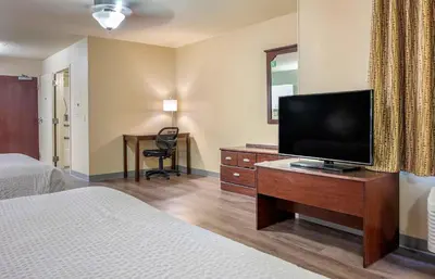 a hotel room with a flat screen tv and a desk at Extended Stay America Suites - Los Angeles - Simi Valley in Santa Susana Knolls