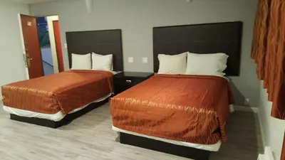 a hotel room with two beds in a room at Guest Harbor Inn- Port Of Los Angeles San Pedro in San Pedro