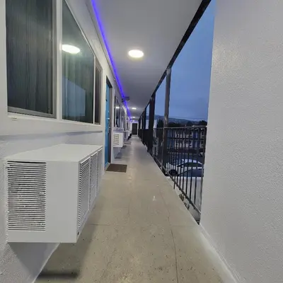 a balcony with a white air conditioner on a building at Guest Harbor Inn- Port Of Los Angeles San Pedro in San Pedro