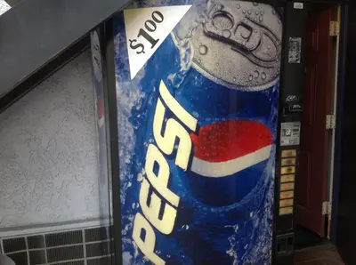 a vending machine with a bottle of soda at Beach Inn in Long Beach
