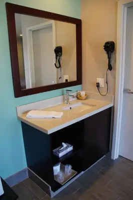 a bathroom with a sink and a mirror at Beach Inn in Long Beach