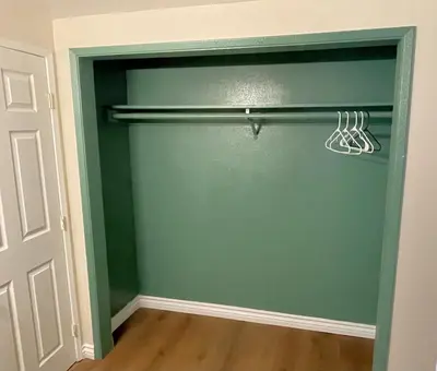 a green garage door with a hanger in a room at Relax Inn in Los Angeles