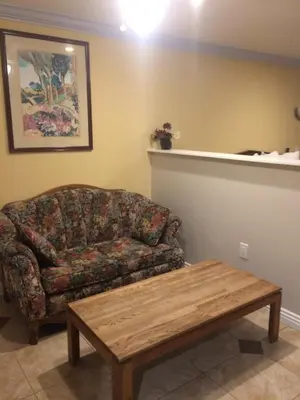 a living room with a couch and a coffee table at Royal Inn in Lomita