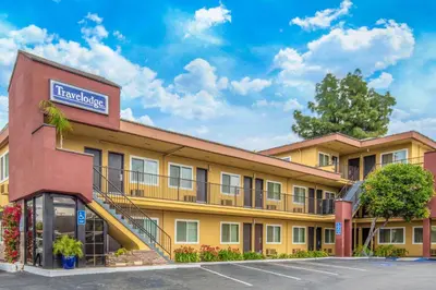 a building with a sign for a hotel at Travelodge by Wyndham Burbank-Glendale in Burbank