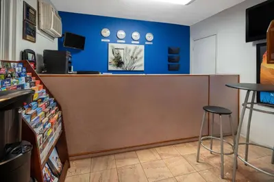 a store with a counter and stools in a room at Travelodge by Wyndham Burbank-Glendale in Burbank