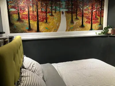 a bedroom with a large window with a painting at VacaStay on Scandia Way in Los Angeles