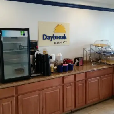 a kitchen counter with a appliance on top of it at Days Inn by Wyndham Orange Anaheim in Orange