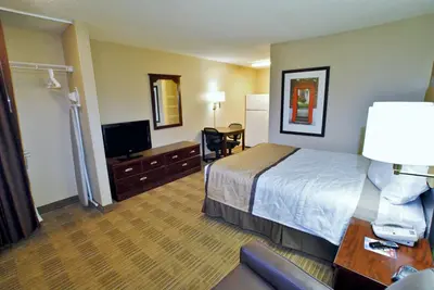 a hotel room with a bed and a television at Extended Stay America Suites - Bakersfield - California Avenue in Bakersfield