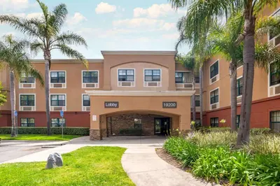 a building with palm trees in front of it at Extended Stay America Suites - Los Angeles - Torrance Harborgate Way in Carson