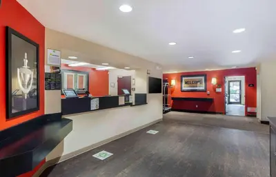 a lobby of a hospital with orange walls at Extended Stay America Suites - Los Angeles - Torrance Blvd in Torrance