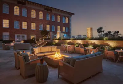 a patio with couches and a fire pit in front of a building at Casa Del Mar in Los Angeles