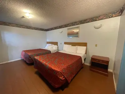 a hotel room with two beds in a room at Chester Inn Motel in Stanton