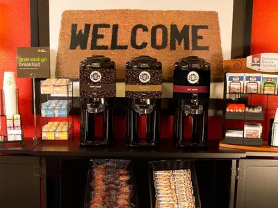 a store with a welcome sign on a counter at Extended Stay America Suites - Orange County - Cypress in Cypress