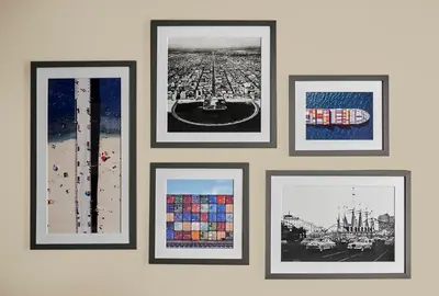 a group of framed pictures hanging on a wall at Hyatt Centric the Pike Long Beach in Long Beach